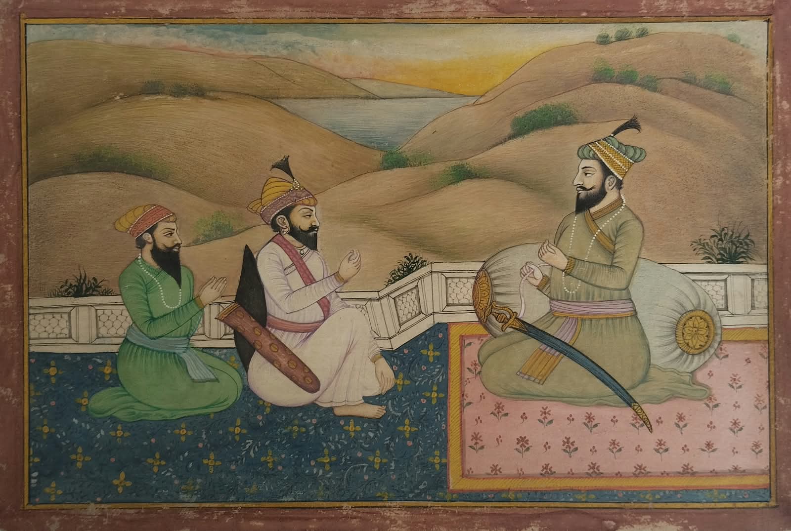 Mughal miniature painting depicting Sikh Guru against a bolster